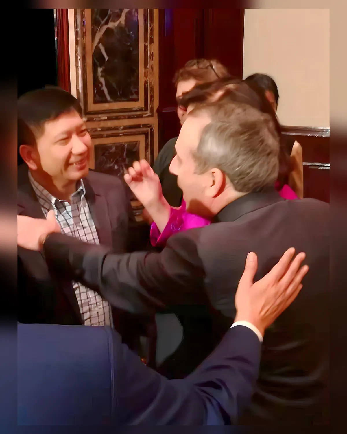 A warm embrace with Harvard University President Lawrence Bacow.