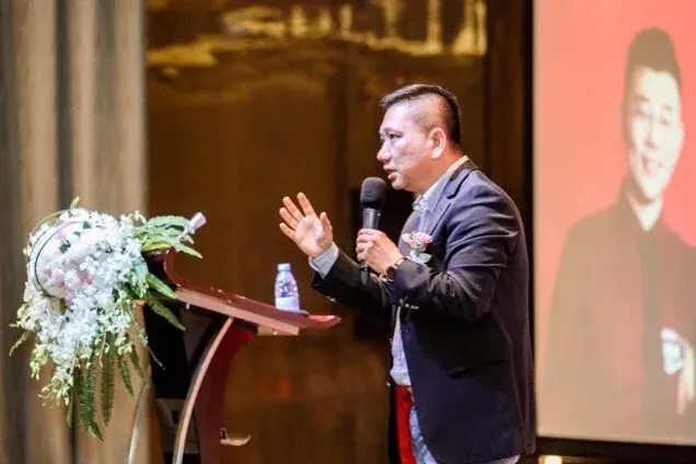 Eric Cheung delivering a keynote on stage