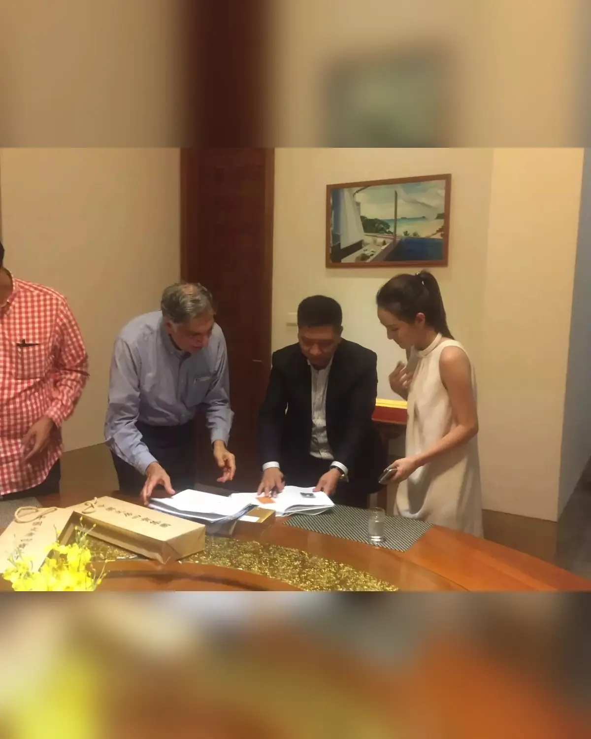 Reviewing partnership documents with Mr. Ratan Tata in Hainan, China.